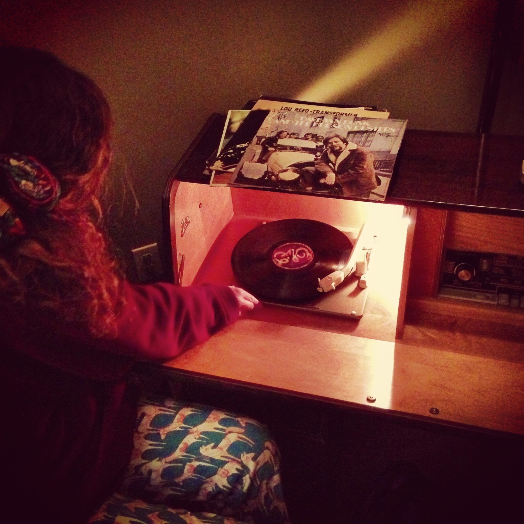 Carissa spinning tunes on the old record player