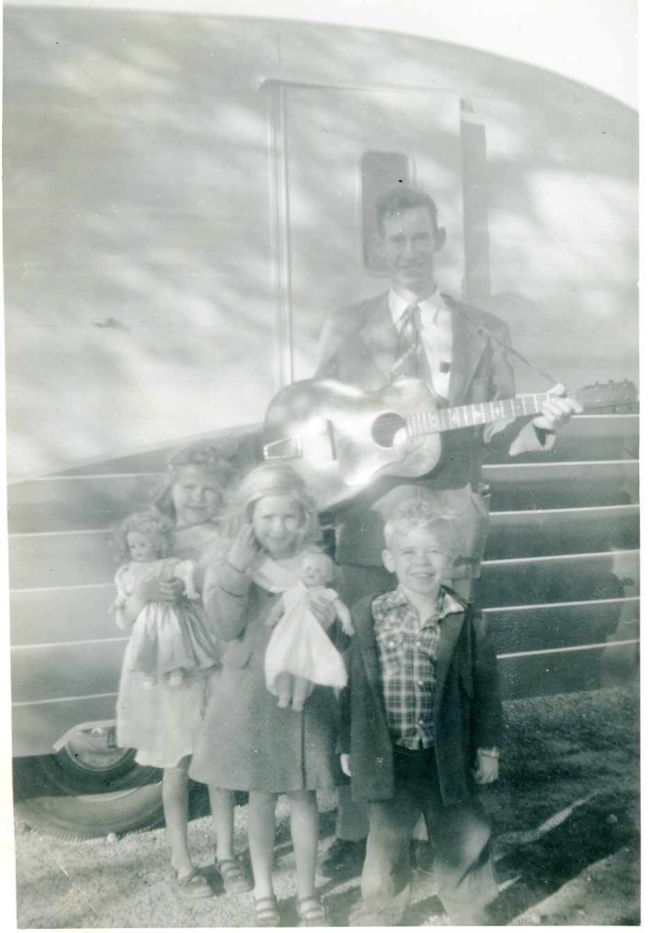 My guitar playing dad and my smiling sisters Cynthia and Linda and brother Richard